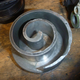 Illustration for article titled Tore Apart A Scroll Compressor.